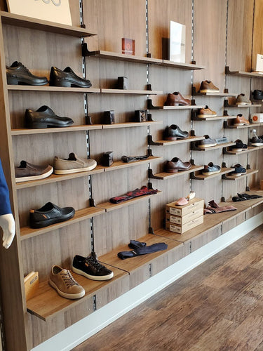 Shoes on Flexline wall standards and shelves at Omar Shoes